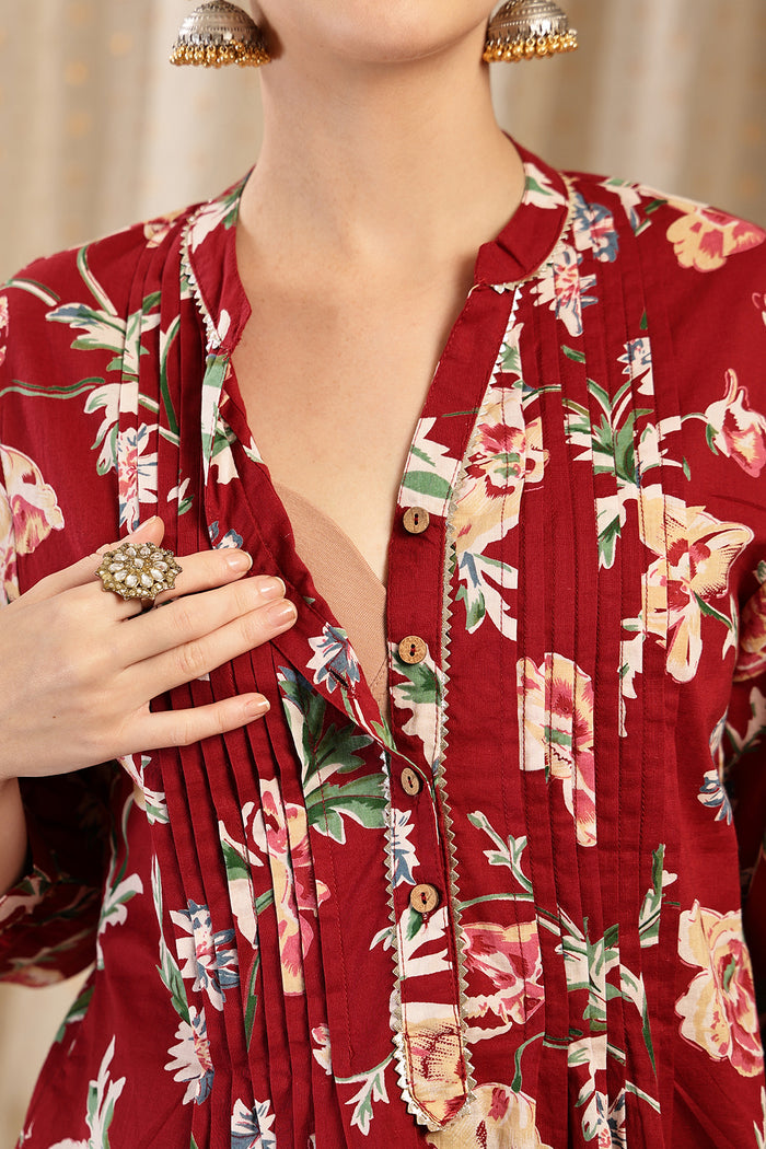 Model wearing Maroon Top; garment provides coverage and shape for a changing body.