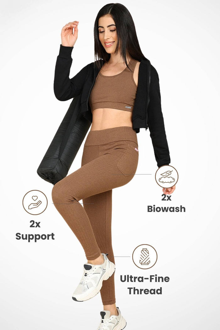 Model wearing Melange Brown Mom Legging; high waist design shows fit and supports the abdomen.