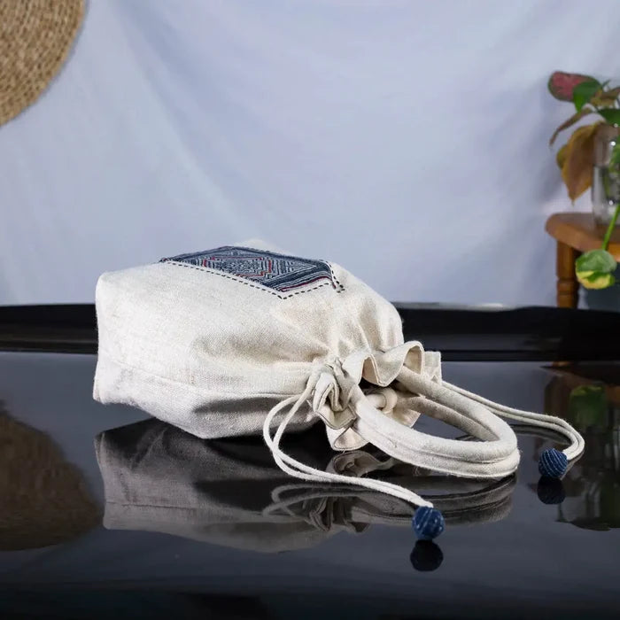White hemp bucket bag with H’Mong batik patch – folded view