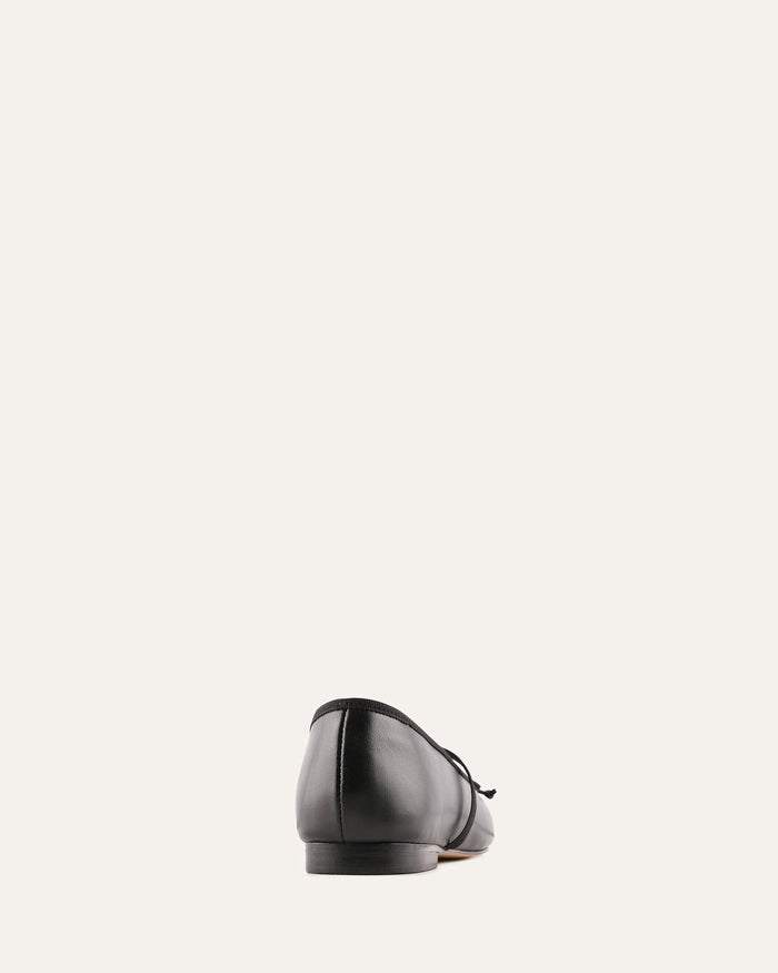 Black shoe on a light gray background