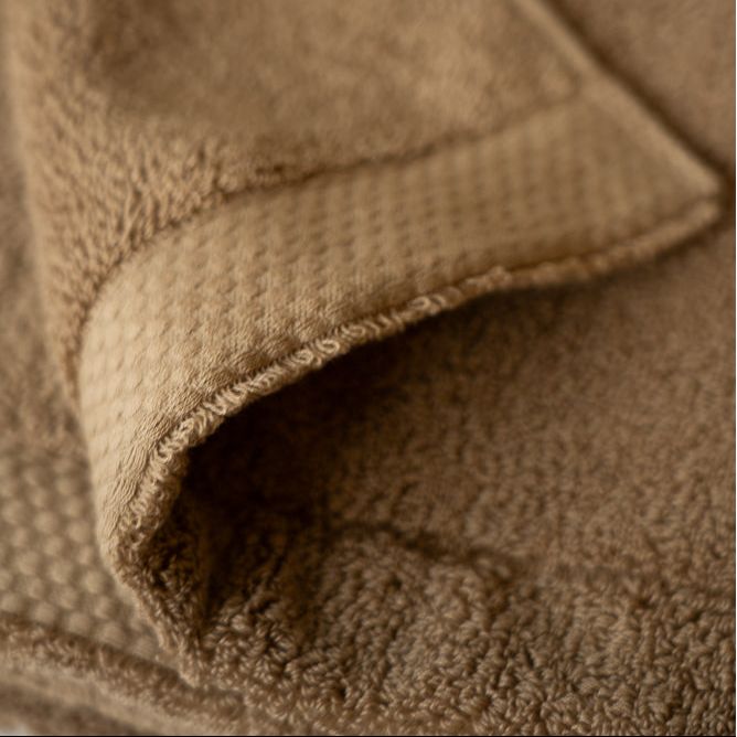 Close-up of a brown textured fabric surface