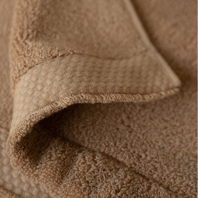 Close-up of a brown textured fabric surface