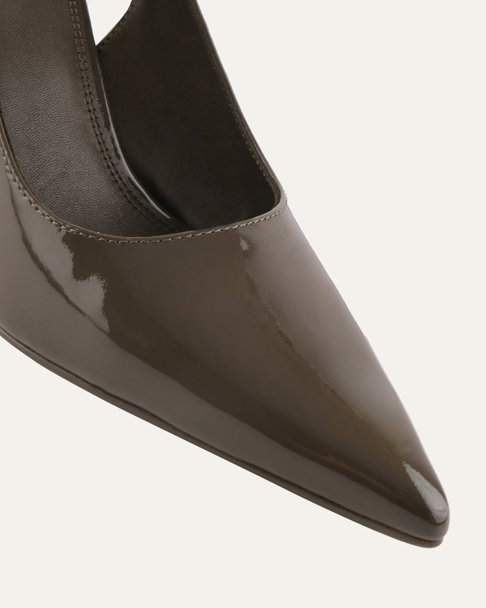 Shiny brown pointed-toe shoe on a light gray background