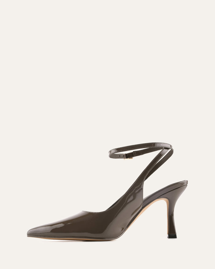 Black high-heeled shoe with slingback design on a white background