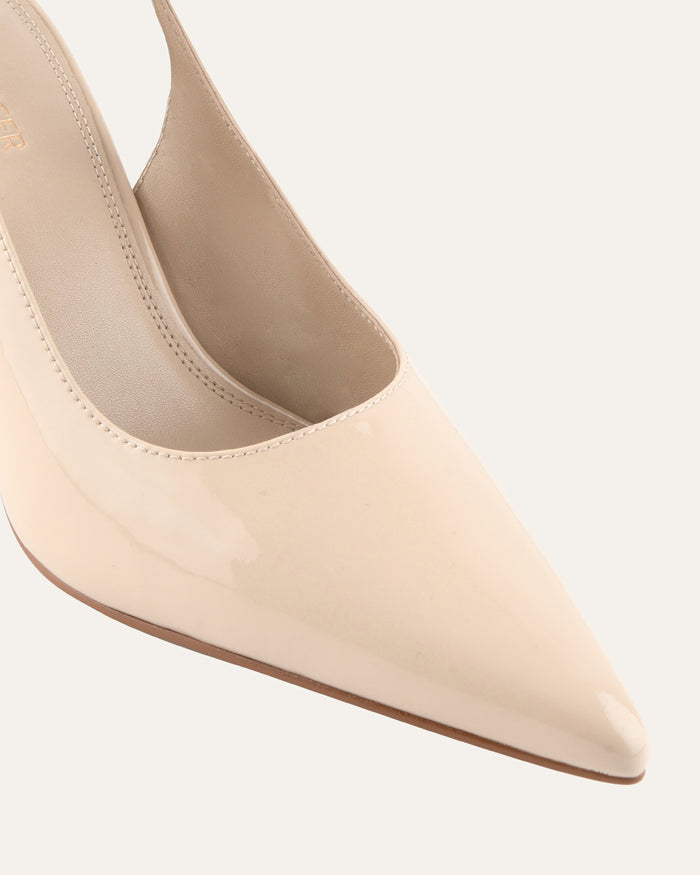 Beige pointed-toe shoe on a white background