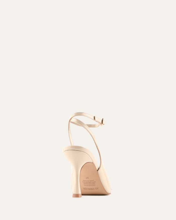 Beige high-heeled shoe on a white background