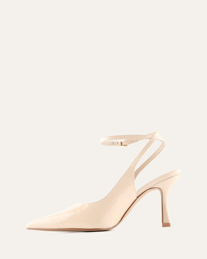 Beige high-heeled shoe on a light beige background