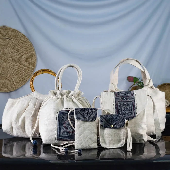 Set of handcrafted hemp handbags from the Purity Collection with bamboo handles and H’mong patch