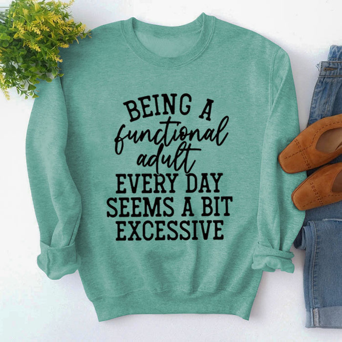 Light green sweater (black font) / S