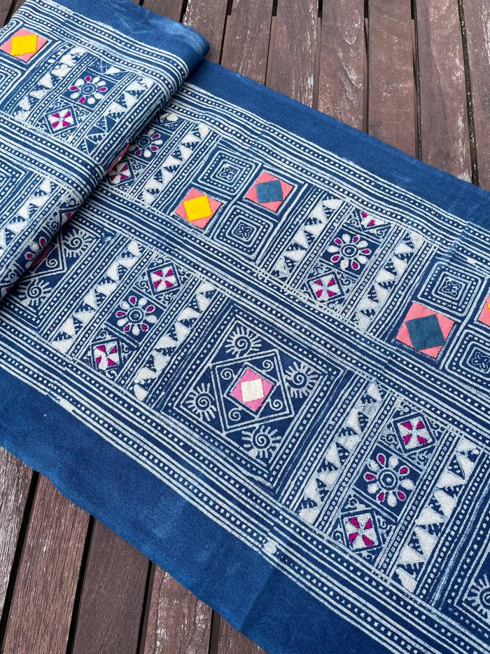 Block print batik with embroidery and appliqué on cotton in geometric flowery pattern