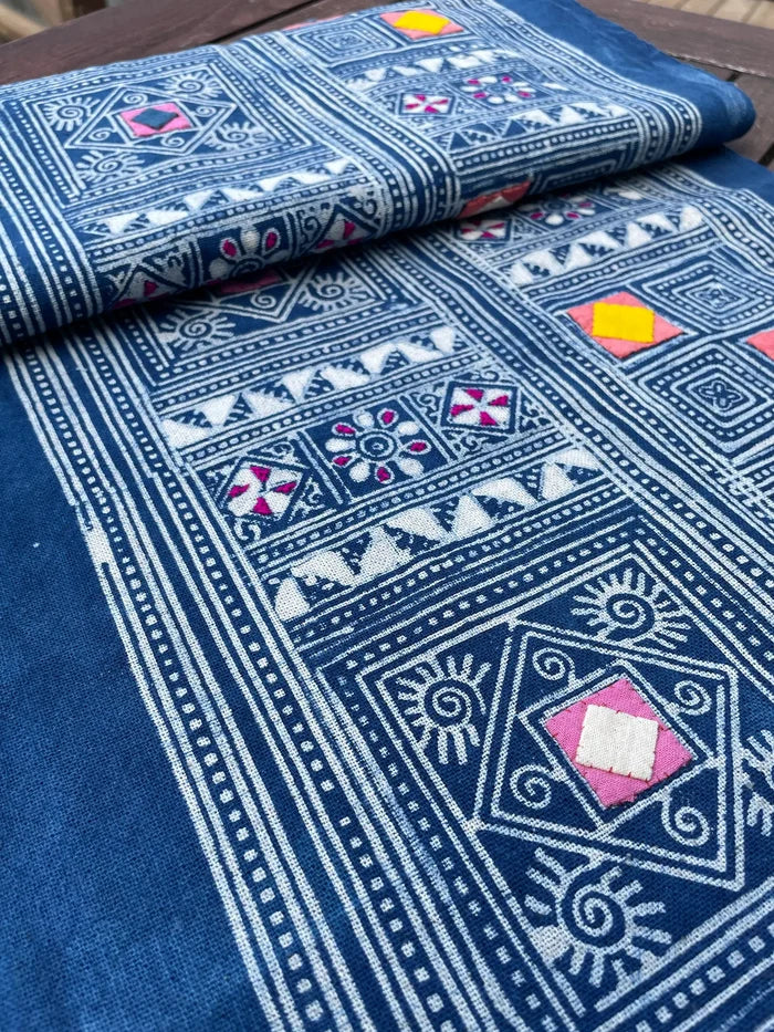 Block print batik with embroidery and appliqué on cotton in geometric flowery pattern