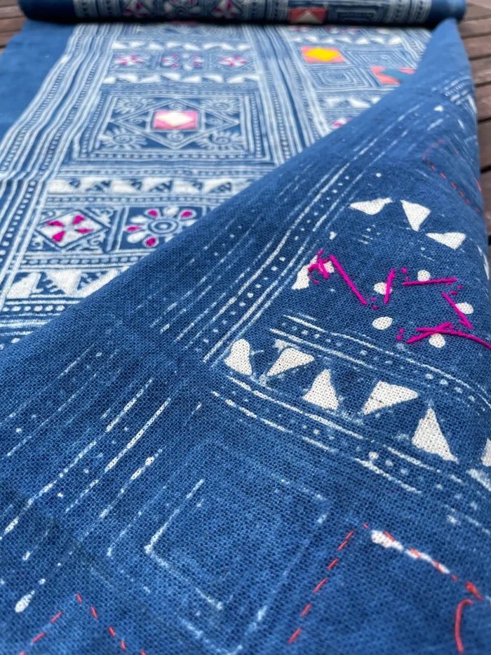 Block print batik with embroidery and appliqué on cotton in geometric flowery pattern