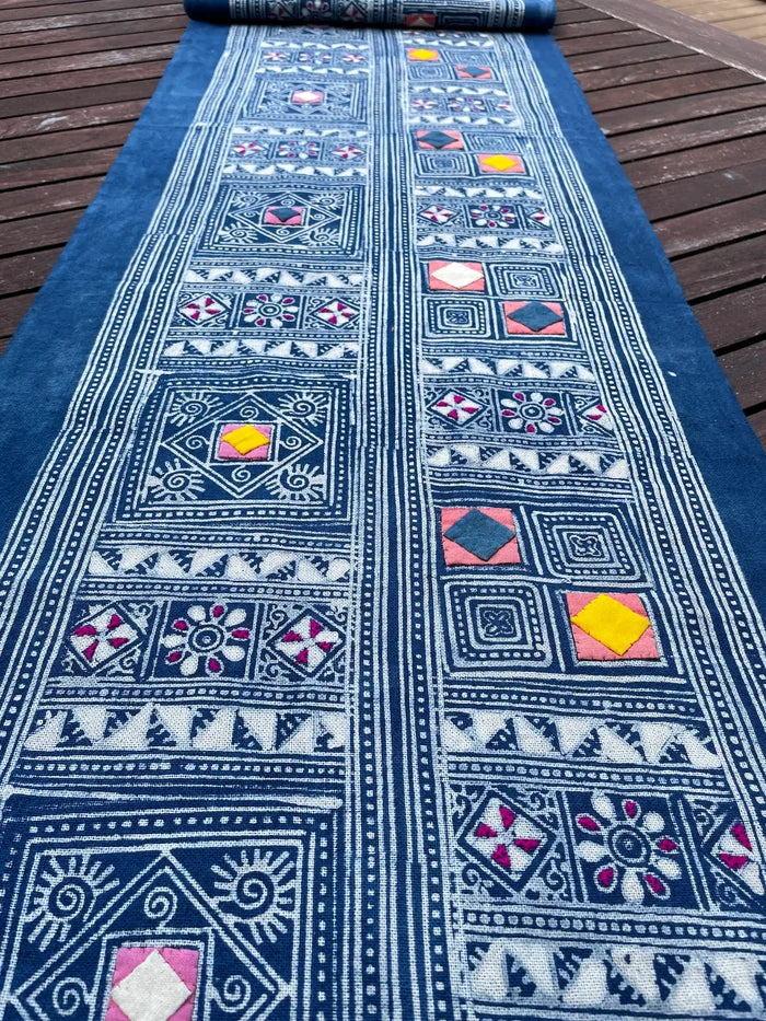 Block print batik with embroidery and appliqué on cotton in geometric flowery pattern