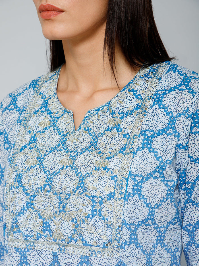 Detailed shot of the Cotton fabric and color/print of the Blue and White Embroidery & Sequins Kurti Kurti.