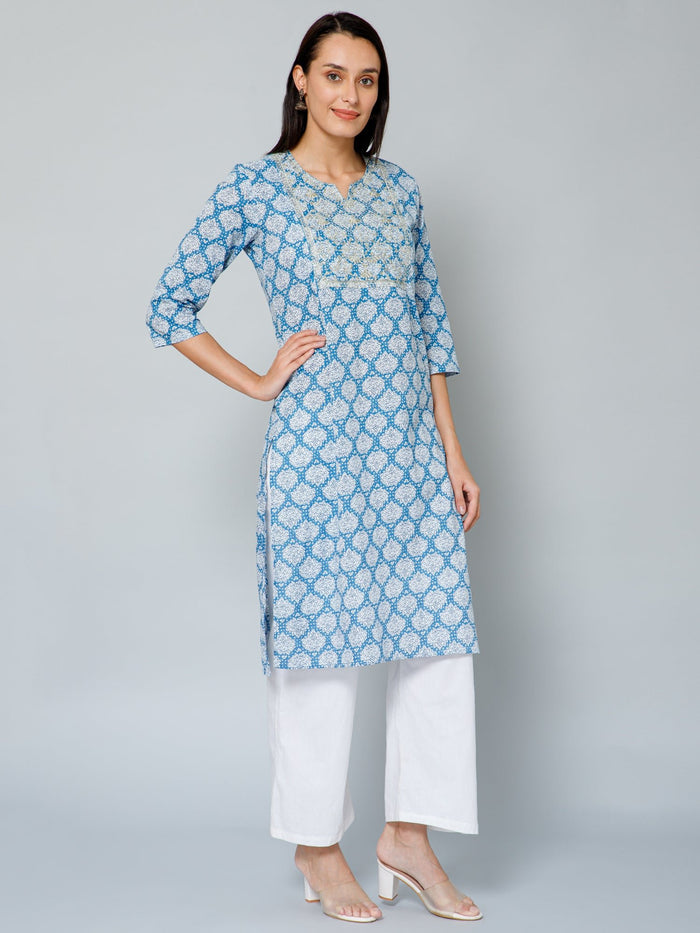 Side profile of the Blue and White Embroidery & Sequins Kurti Kurti, demonstrating the comfortable A-line fit for pre...