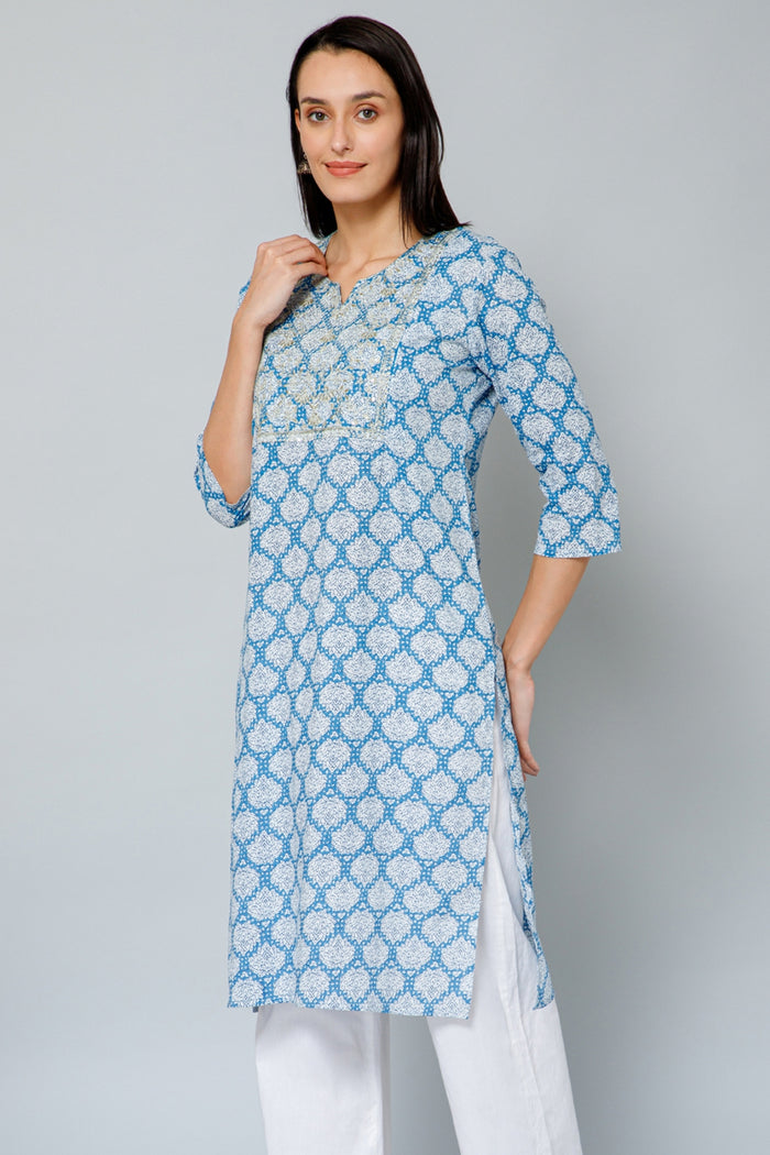 Back view of the Blue and White Embroidery & Sequins Kurti Kurti, showcasing the flowing long-sleeve kurti.