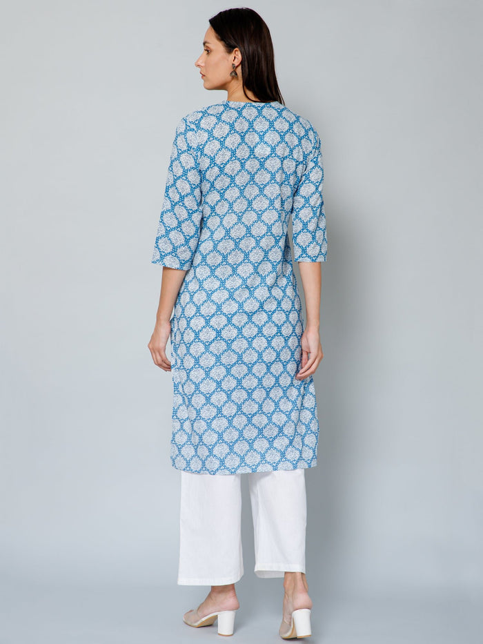 Model posing, highlighting the accessible discreet nursing zips of the Blue and White Embroidery & Sequins Kurti Kurti.