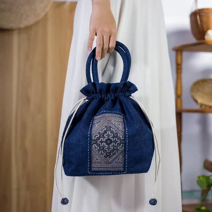 Close-up of indigo hemp bucket bag with H’mong fabric patch, sustainable and stylish