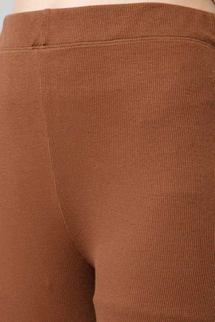Model wearing Caramel Lounge Pants; wide waistband provides soft, non-dig support.