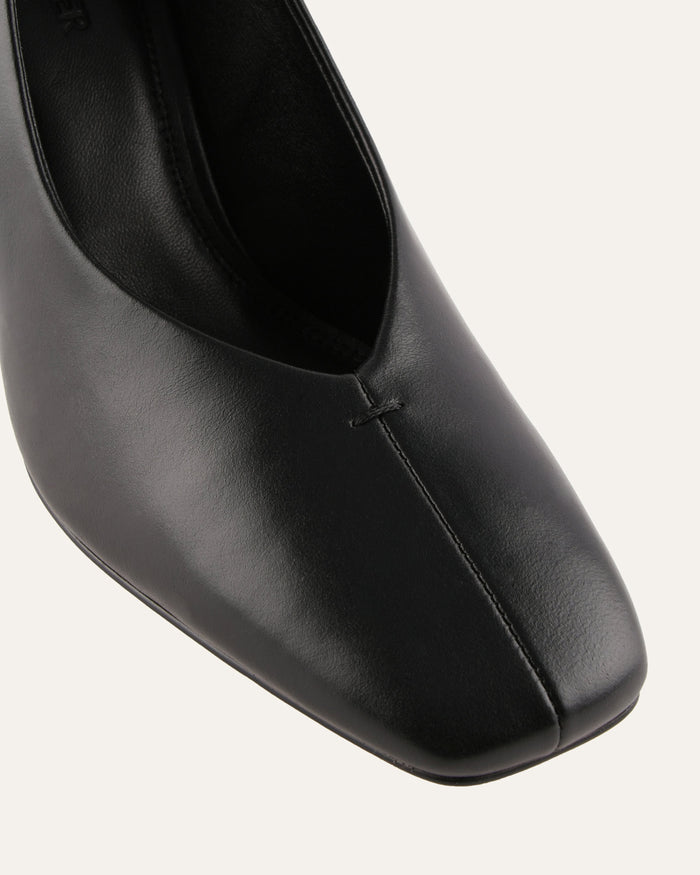 Black leather shoe on a white background