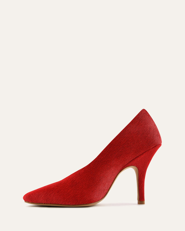 Red high-heeled shoe on a white background