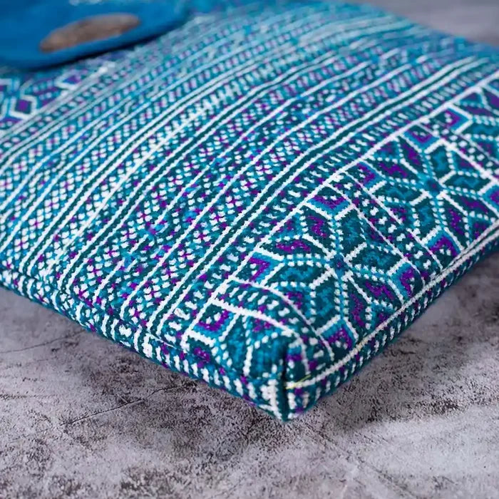 Vindigo blue embroidered crossbody bag bottom view highlighting intricate H’mong pattern
