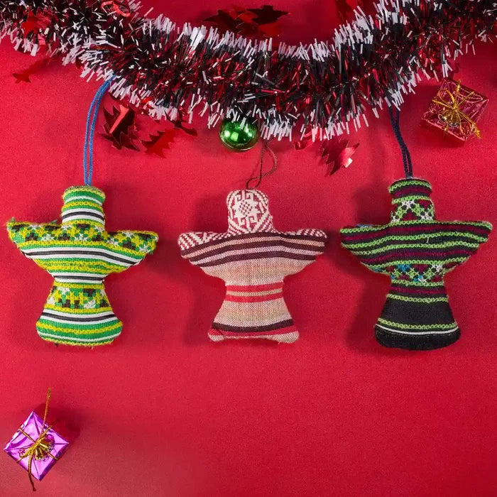 Vindigo green and red tribal embroidered ornaments hanging under garland