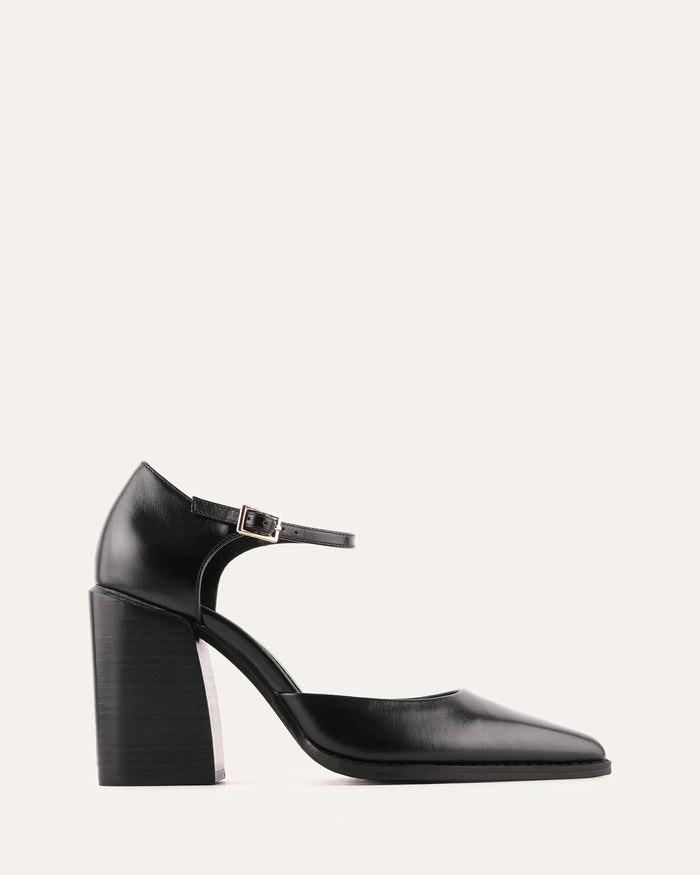 Black high-heeled shoe with a strap on a light gray background