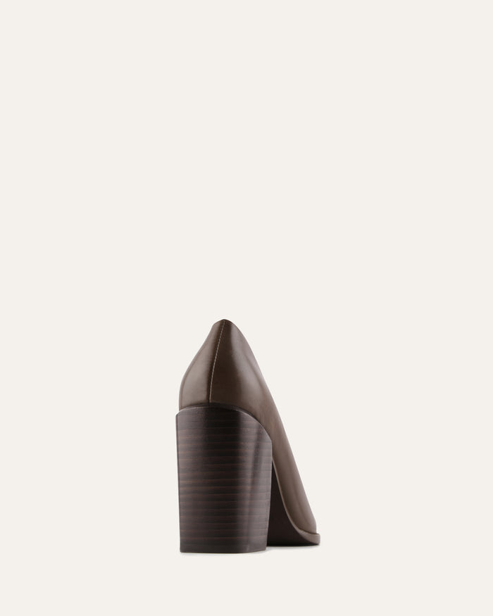 Brown high-heeled shoe on a light beige background