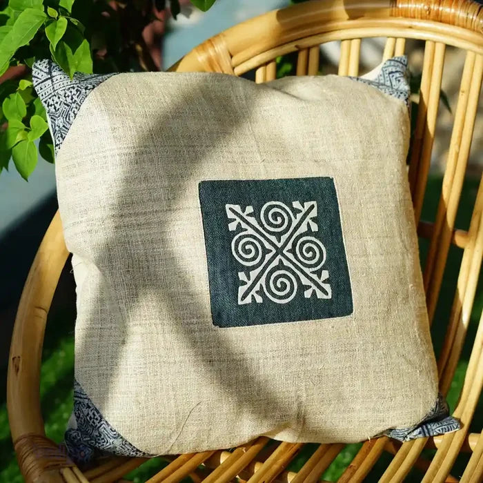 Side angle of indigo batik cushion in natural setting