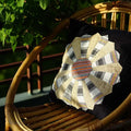 Vindigo indigo hemp cushion with Dresden Plate pattern on wooden chair