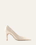 White high-heeled shoe on a light gray background