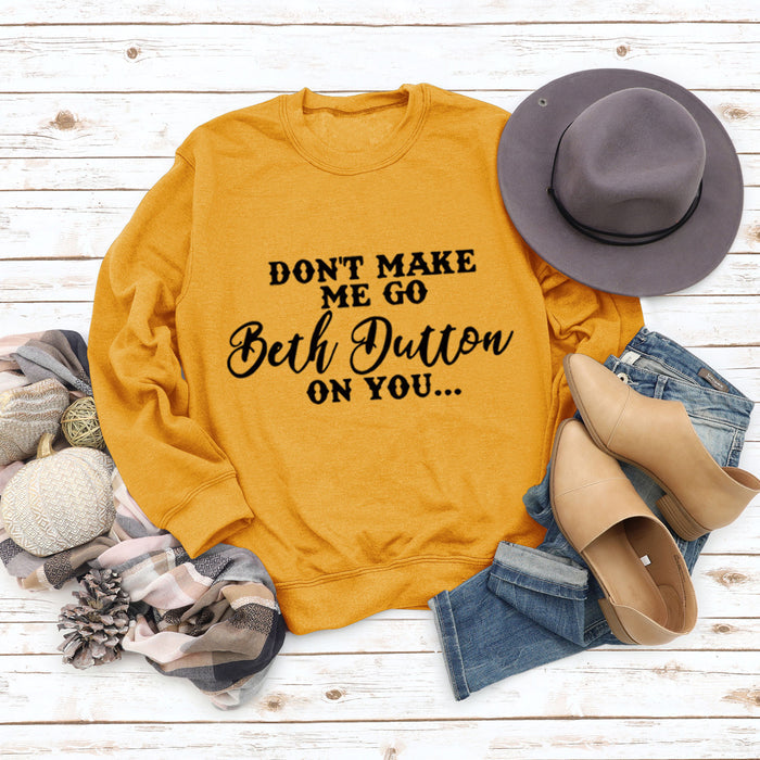 Yellow sweater (black font) / S