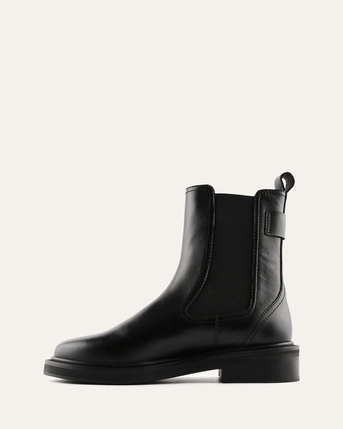 Black leather Chelsea boot on a white background