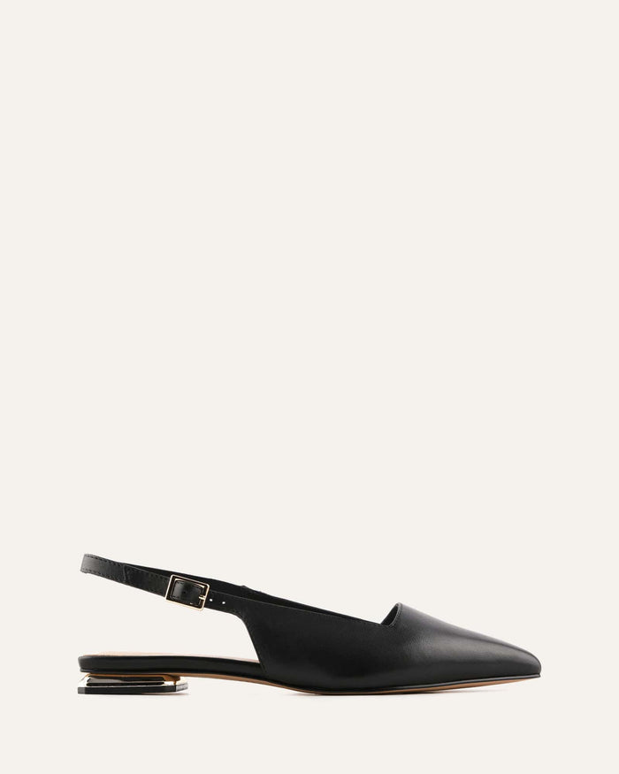 Black slingback flat shoe on a light gray background