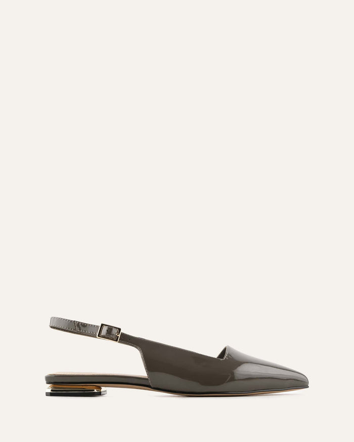 green patent leather slingback flat shoe on a white background
