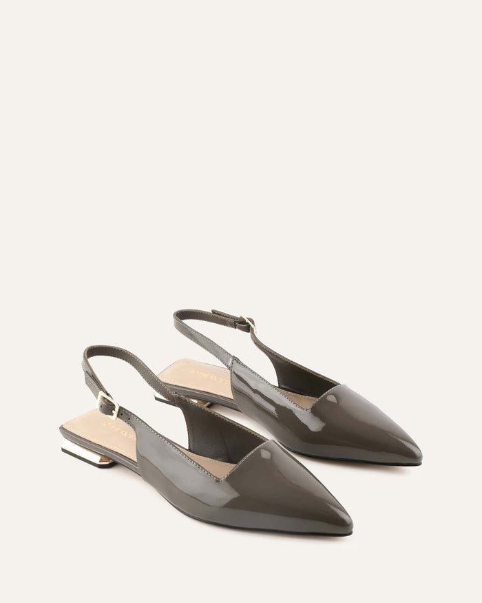Pair of gray slingback flats on a white background