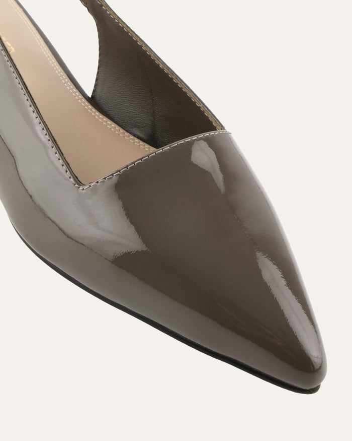 Shiny gray pointed-toe shoe on a light gray background