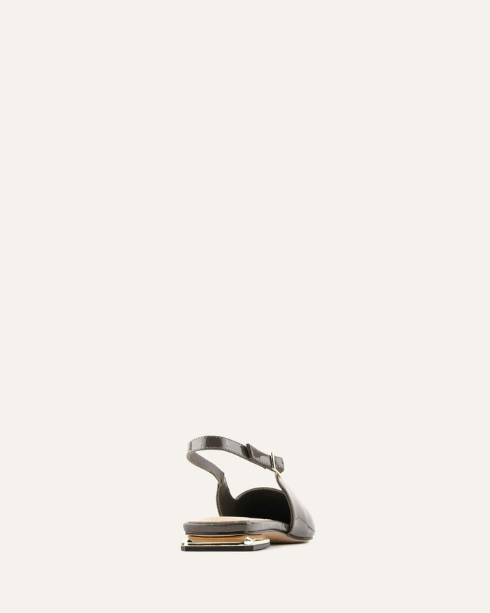 Black sandal with a thin strap on a white background
