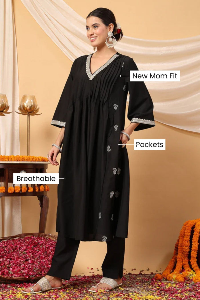 Side profile of the Elegant Black Festive Suit Set, showing the smooth drape of the Polyester fabric.