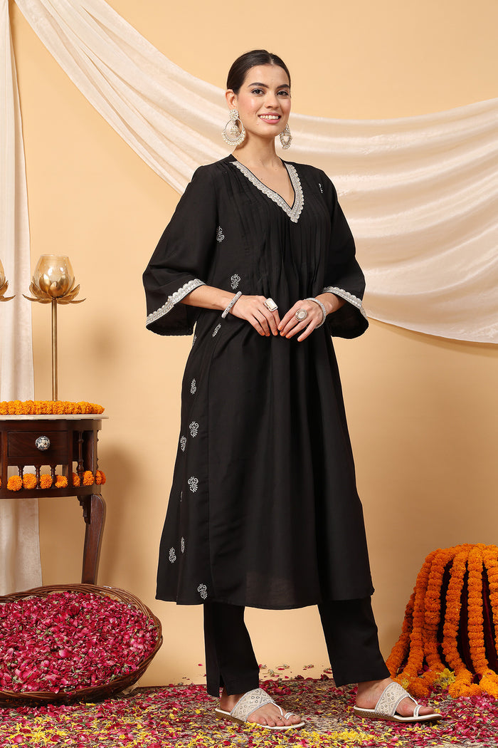 Comfort-focused image of the Elegant Black Festive Polyester Suit Set, designed for style through pregnancy and postpartum.