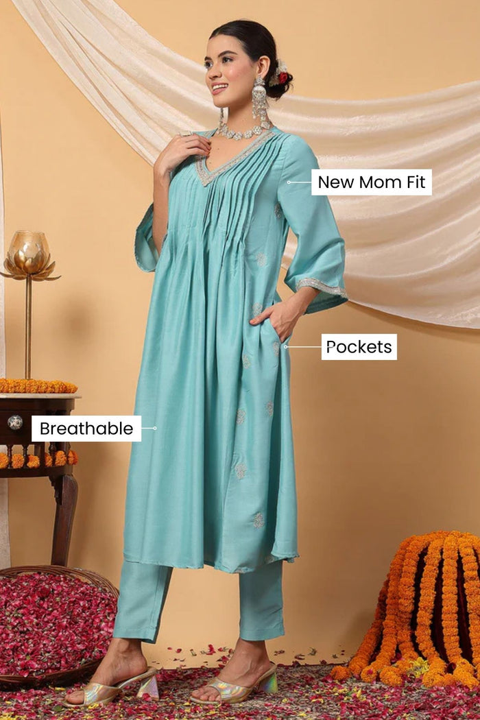 Side profile of the Elegant Turquoise Festive Suit Set, showing the smooth drape of the Polyester fabric.