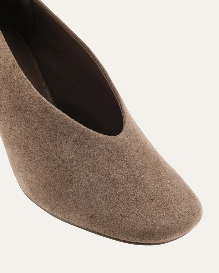 Brown suede shoe on a white background