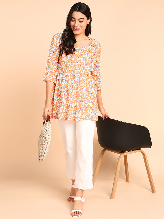 Cantaloupe Top sleeve; sleeves offer coverage and relaxed fit.