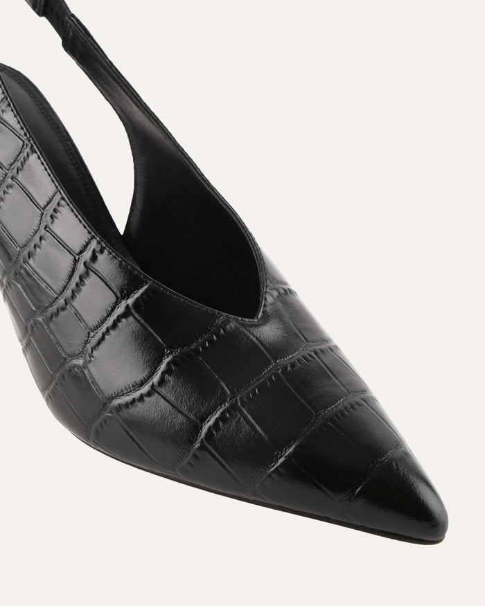 Black crocodile-patterned high-heeled shoe on a white background