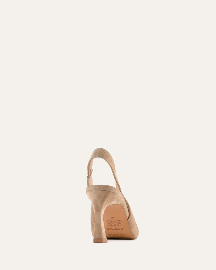 Beige high-heeled shoe on a white background