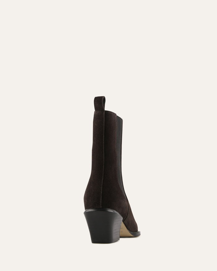 Black ankle boot on a light gray background