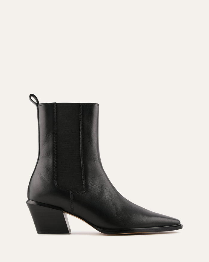 Black ankle boot on a light gray background
