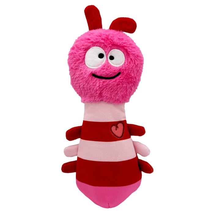 Dog with Fetchies® Love Bug Dog Toy on a white background.