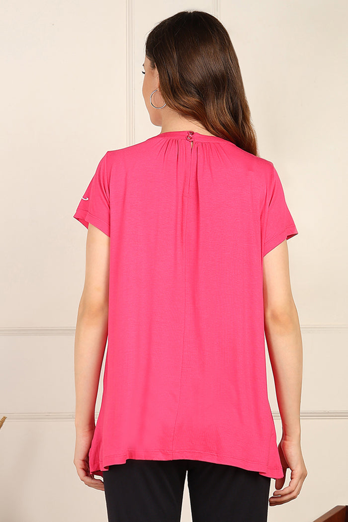 Fuchsia Pleated detail; pleats add shape to the maternity top.
